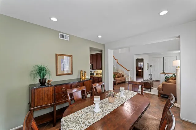a living room with furniture rug and a window