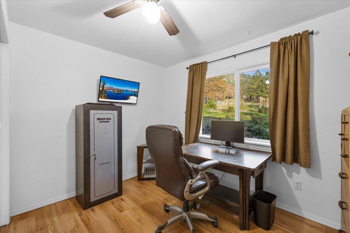 1360 Oxyoke Road Grants Pass, OR 97526 - Photo 26 of 39 a view of a workspace with furniture and a window