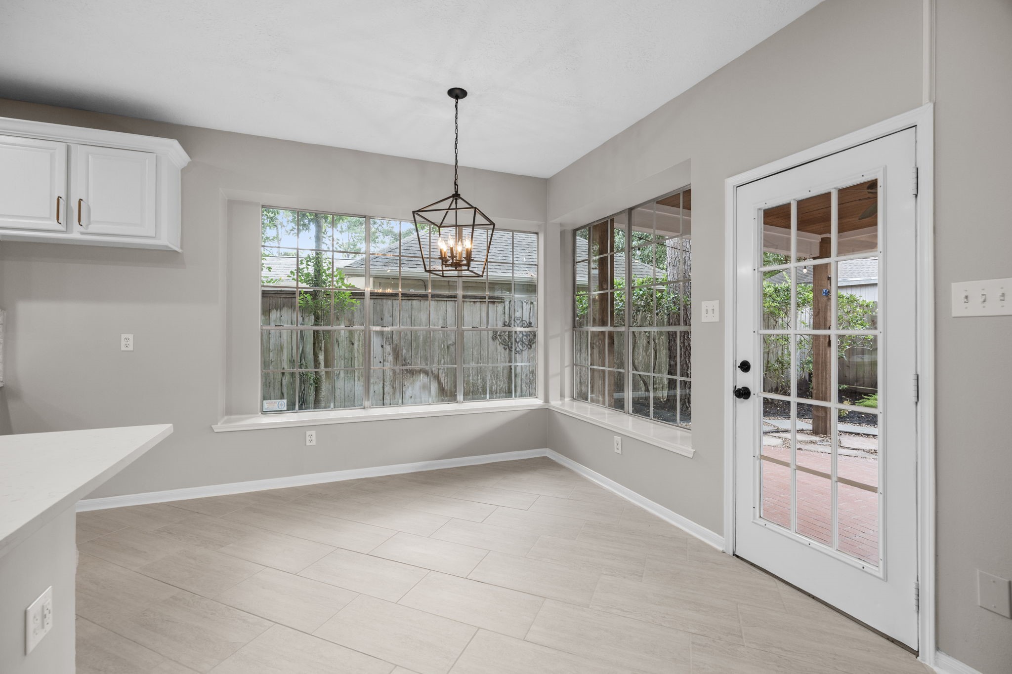 9015 Rhapsody Lane Houston, TX 77040 - Photo 16 of 39 This bright breakfast nook is surrounded by oversized windows, filling the space with natural light and offering peaceful views of the backyard. Conveniently located just off the kitchen, it also provides direct access to the covered patio and outdoor living space.
