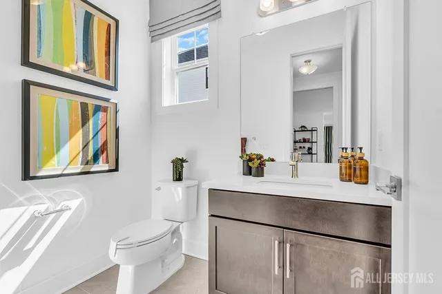 a room with a sink a stove and a refrigerator