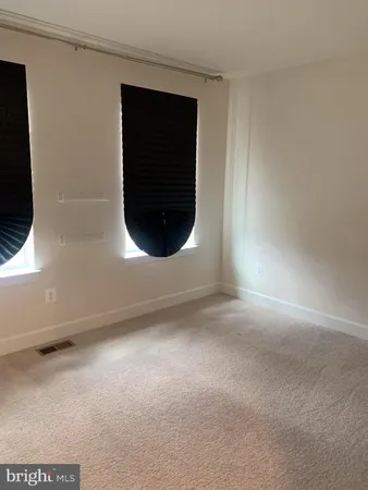 a bathroom with a tub sink shower and mirror
