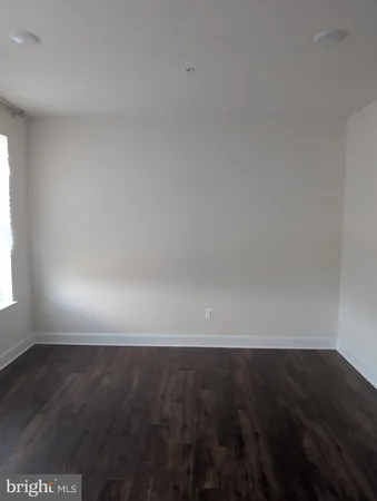 a view of room with wooden floor