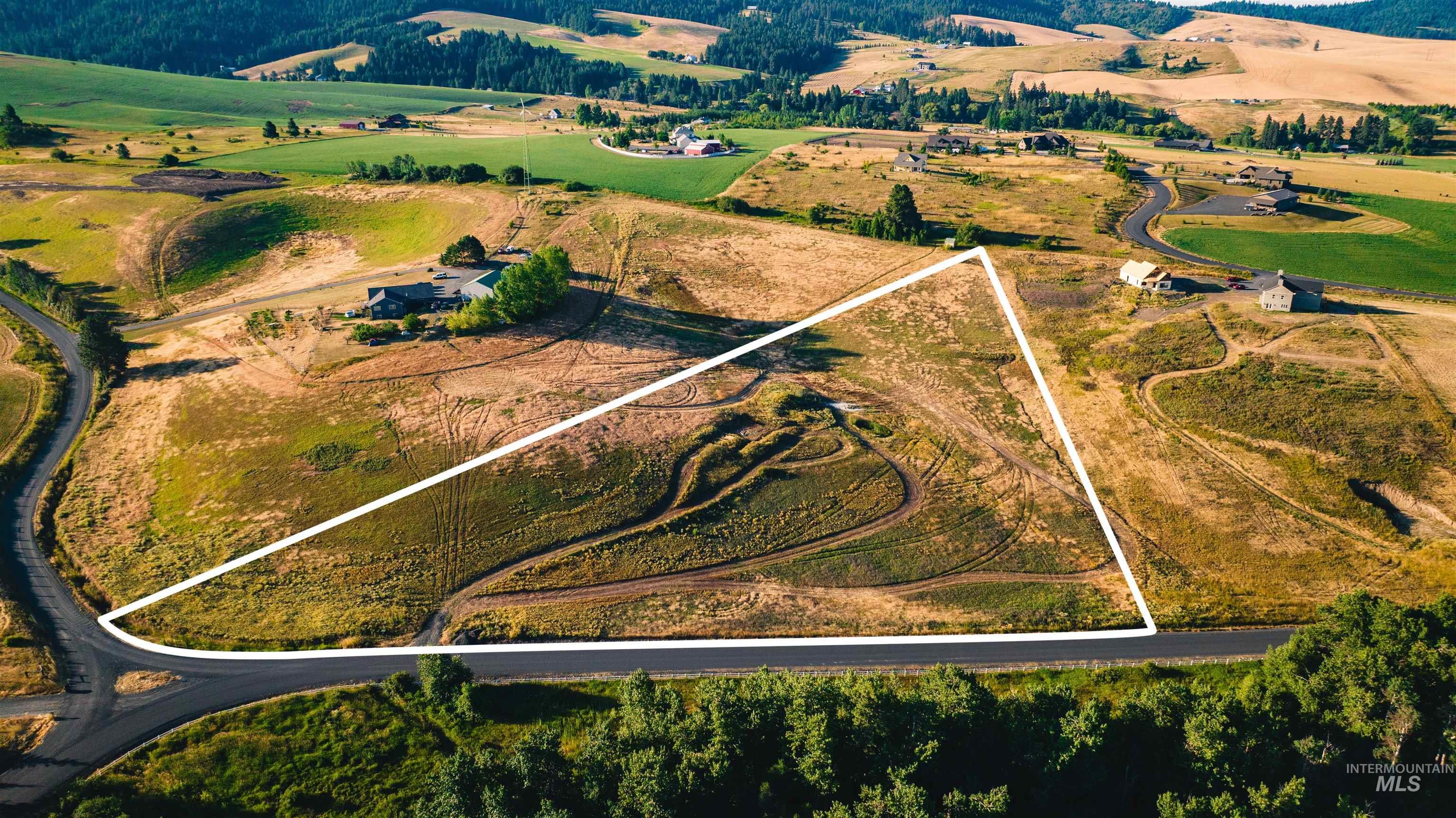 1070 Chaney Road Viola, ID 83872 - Photo 2 of 16 Aerial view of property and surrounding area with property boundaries highlighted and rural landscape