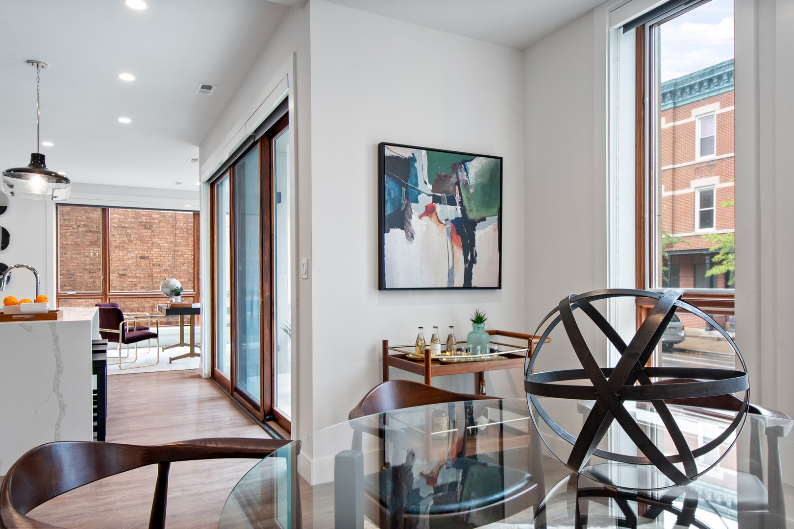 1901 North Halsted Street, Unit 1A Chicago, IL 60614 - Photo 13 of 38 a view of a livingroom and dining room with furniture window and wooden floor