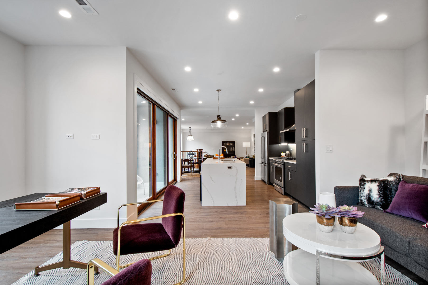 1901 North Halsted Street, Unit 1A Chicago, IL 60614 - Photo 21 of 38 a living room with furniture and kitchen view