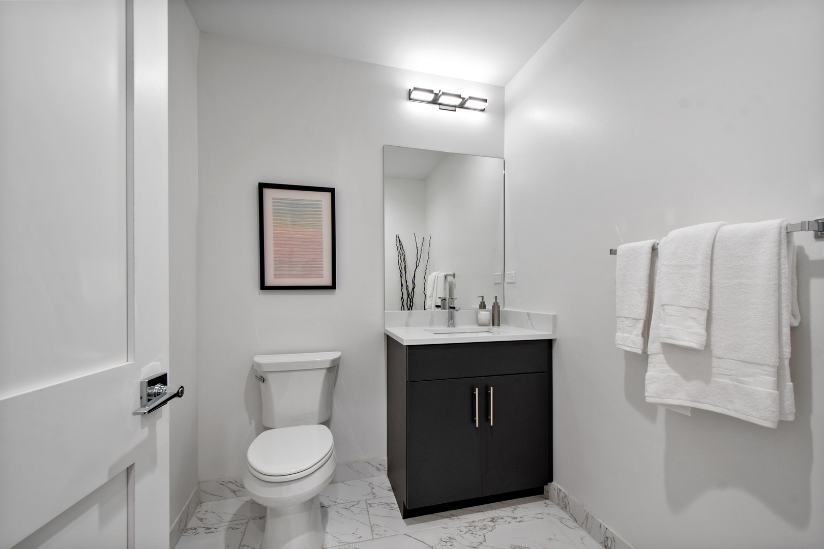 1901 North Halsted Street, Unit 1A Chicago, IL 60614 - Photo 22 of 38 a bathroom with a toilet sink and mirror