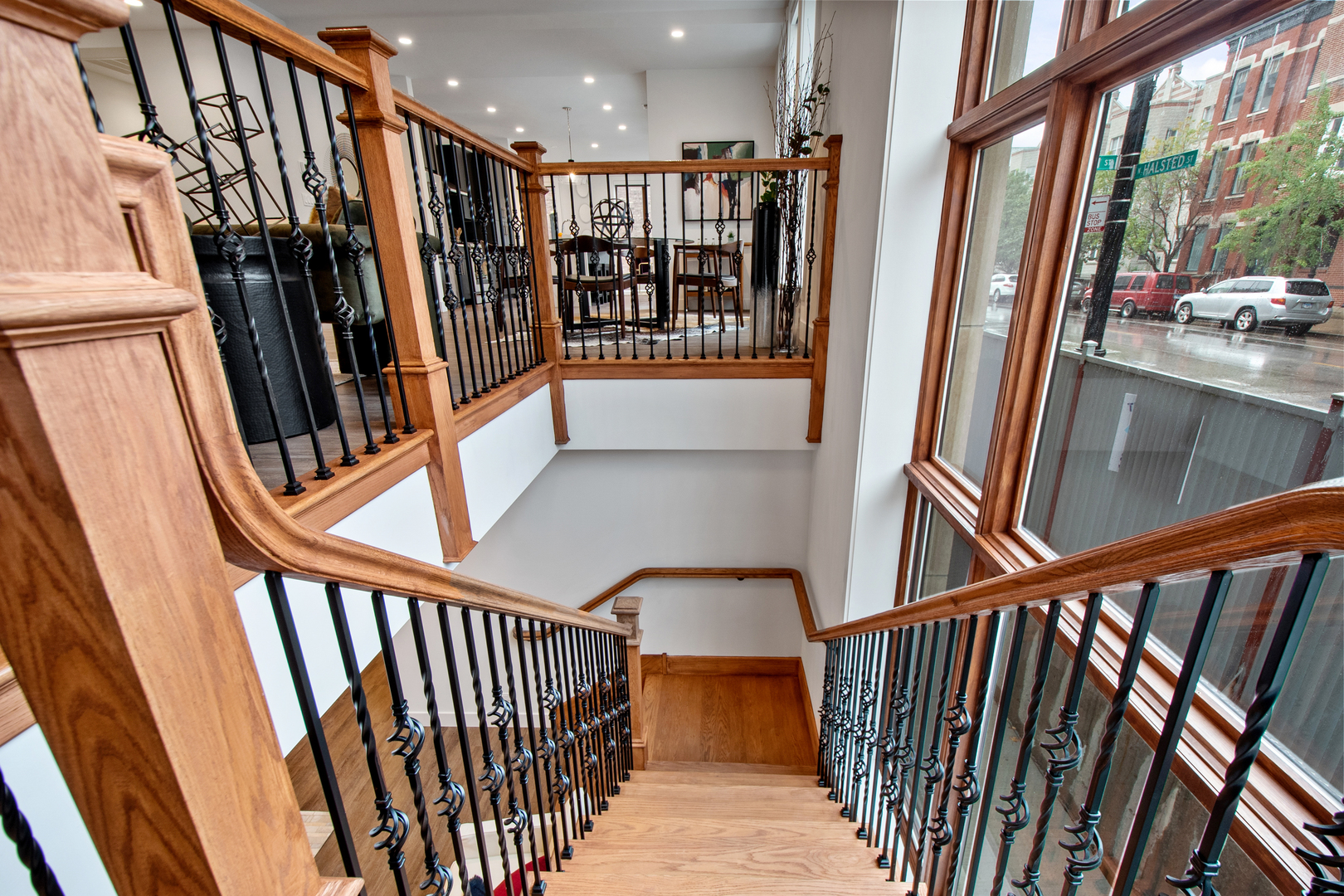 1901 North Halsted Street, Unit 1A Chicago, IL 60614 - Photo 24 of 38 a view of staircase with lots of frames on wall and a window