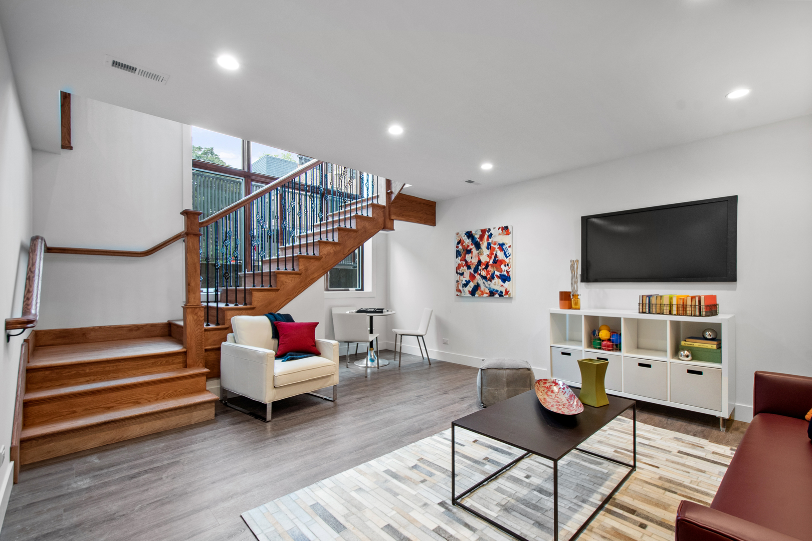 1901 North Halsted Street, Unit 1A Chicago, IL 60614 - Photo 25 of 38 a living room with furniture and a flat screen tv