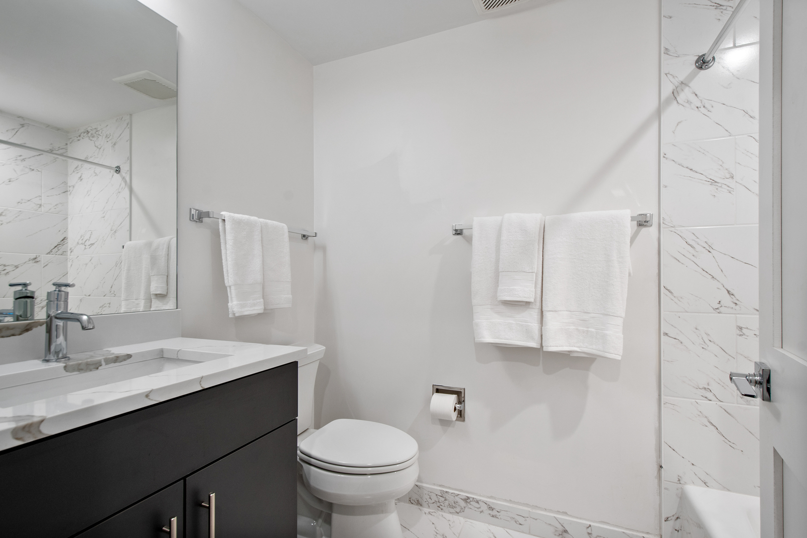 1901 North Halsted Street, Unit 1A Chicago, IL 60614 - Photo 31 of 38 a bathroom with a sink toilet and shower