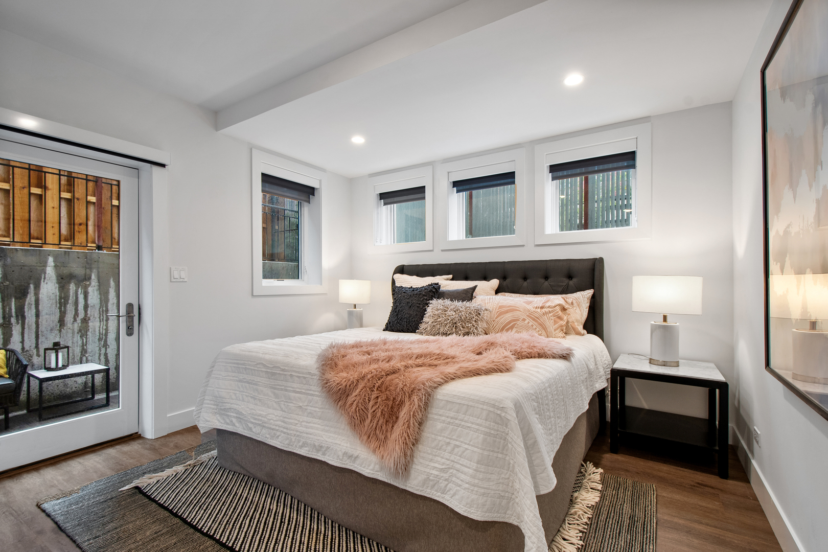 1901 North Halsted Street, Unit 1A Chicago, IL 60614 - Photo 33 of 38 a bedroom with a bed and wooden floor