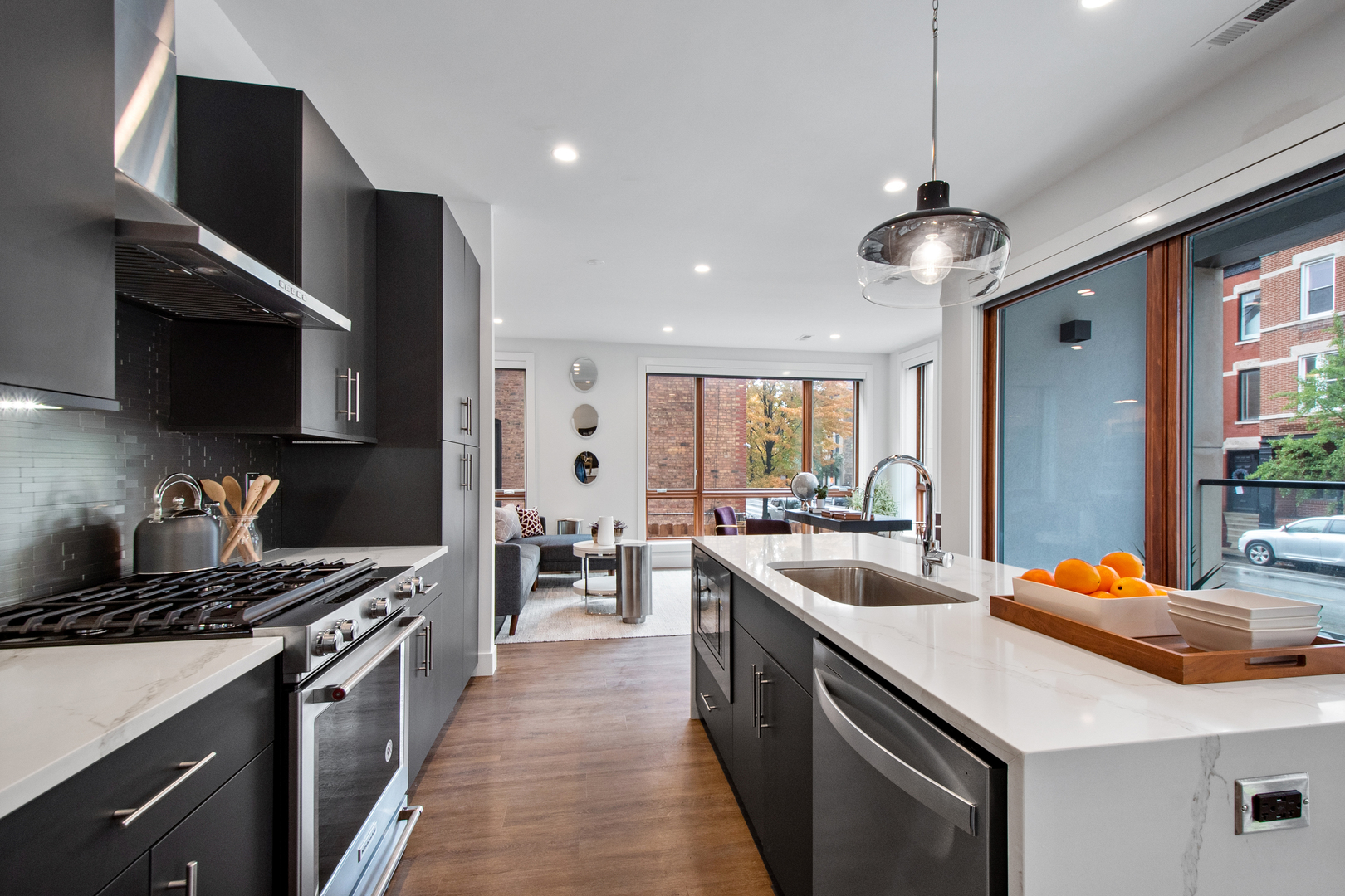 1901 North Halsted Street, Unit 1A Chicago, IL 60614 - Photo 7 of 38 a kitchen with a sink stove and microwave
