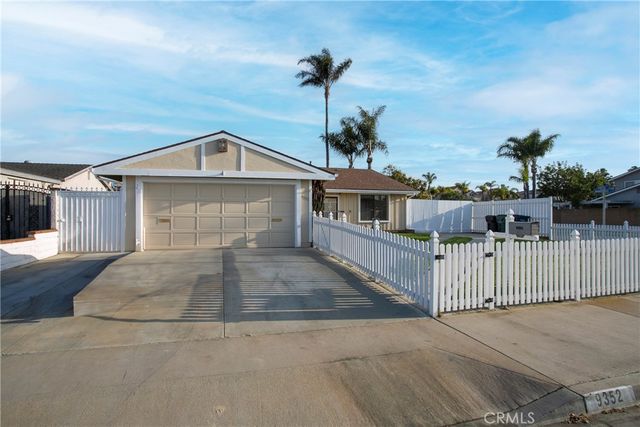 a front view of a house with garage