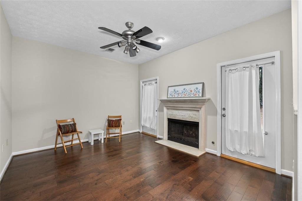 2680 Pine Tree Road Northeast, Unit 5 Atlanta, GA 30324 - Photo 16 of 32 a view of a livingroom with furniture and a fireplace