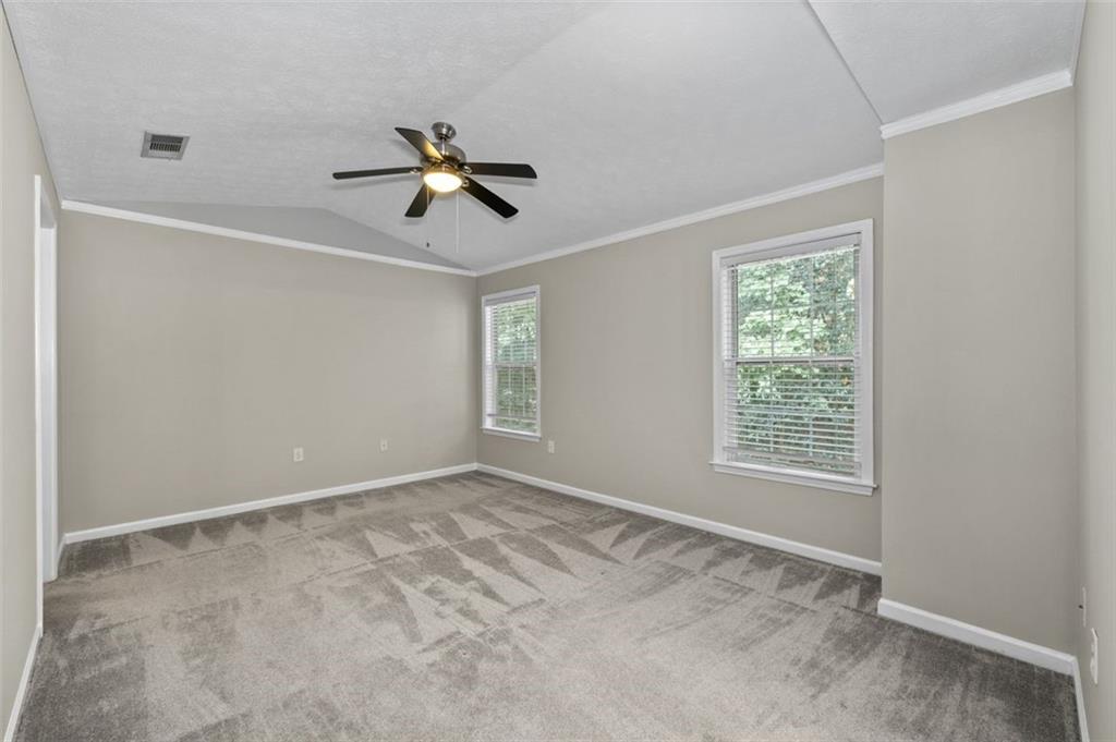 2680 Pine Tree Road Northeast, Unit 5 Atlanta, GA 30324 - Photo 20 of 32 a view of an empty room with a window