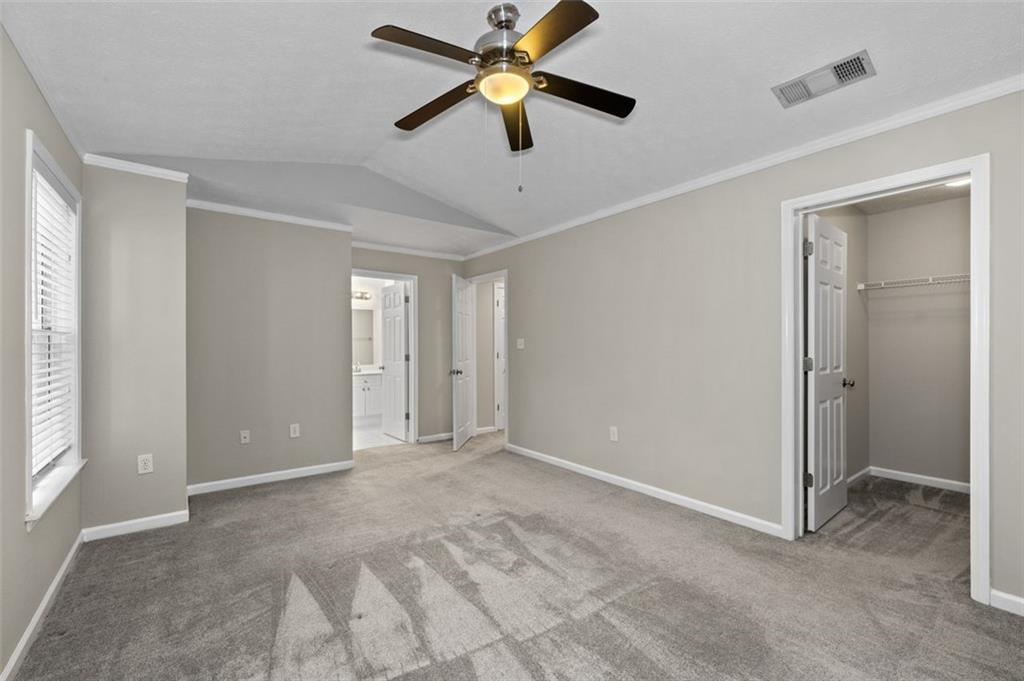 2680 Pine Tree Road Northeast, Unit 5 Atlanta, GA 30324 - Photo 21 of 32 a view of empty room with ceiling fan