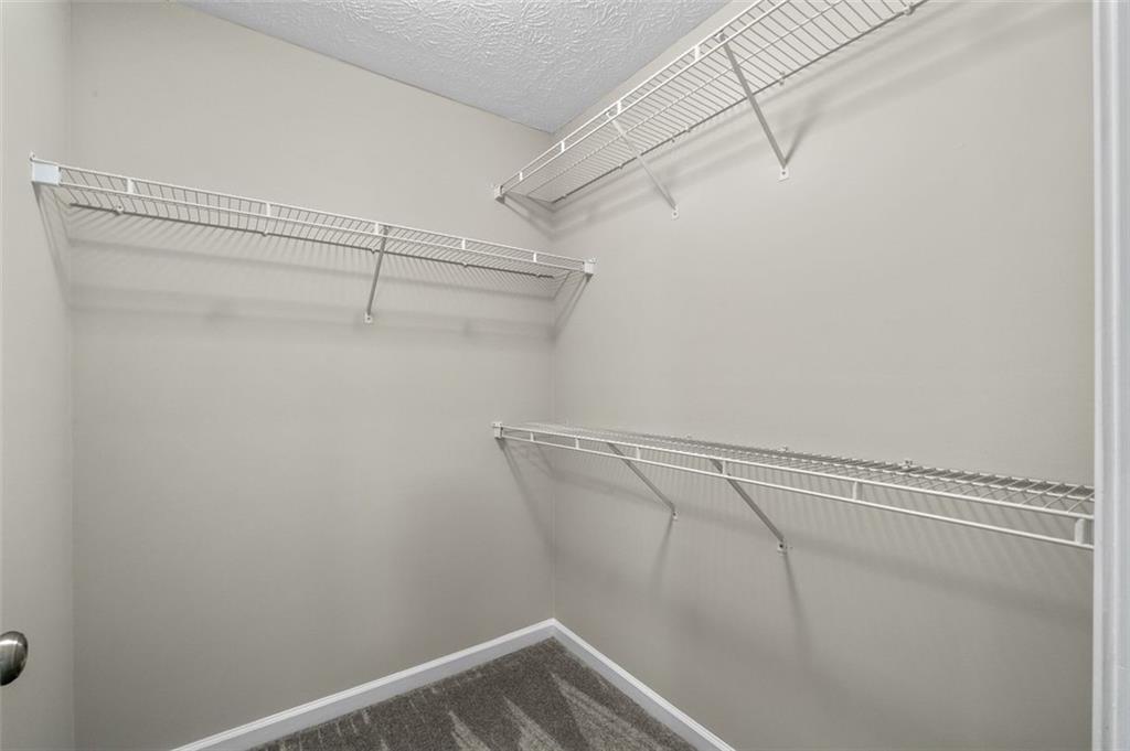 2680 Pine Tree Road Northeast, Unit 5 Atlanta, GA 30324 - Photo 22 of 32 a view of a room with racks on the wall