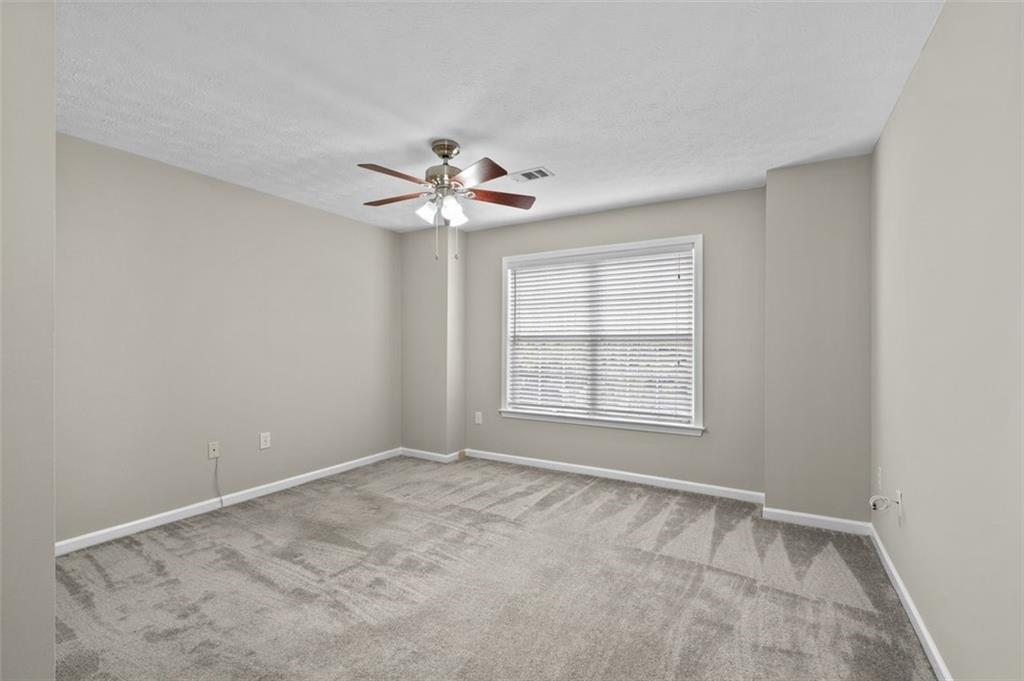 2680 Pine Tree Road Northeast, Unit 5 Atlanta, GA 30324 - Photo 26 of 32 a view of an empty room with a window