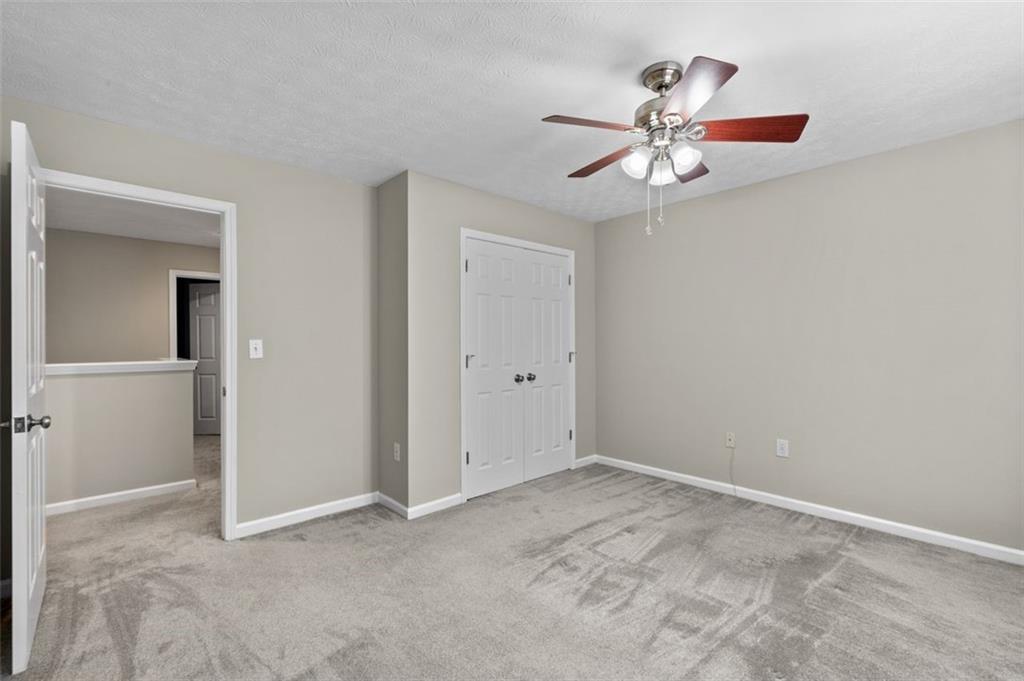 2680 Pine Tree Road Northeast, Unit 5 Atlanta, GA 30324 - Photo 27 of 32 a view of an empty room with a window