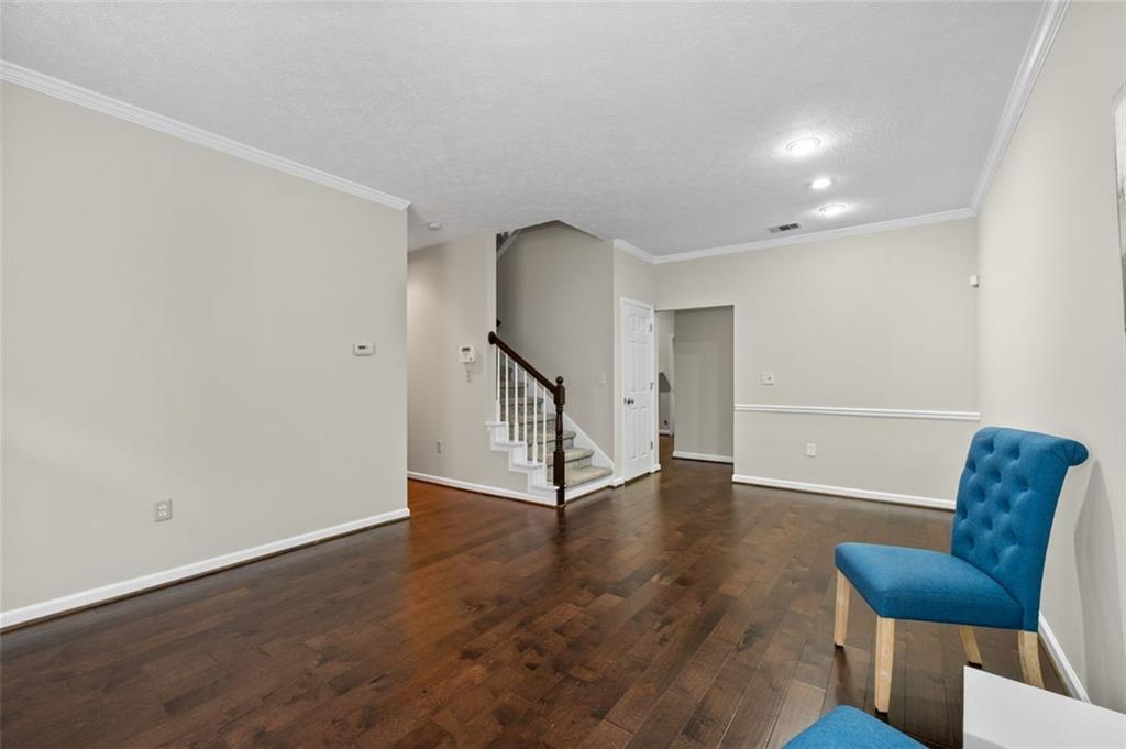 2680 Pine Tree Road Northeast, Unit 5 Atlanta, GA 30324 - Photo 6 of 32 a view of an entryway with wooden floor