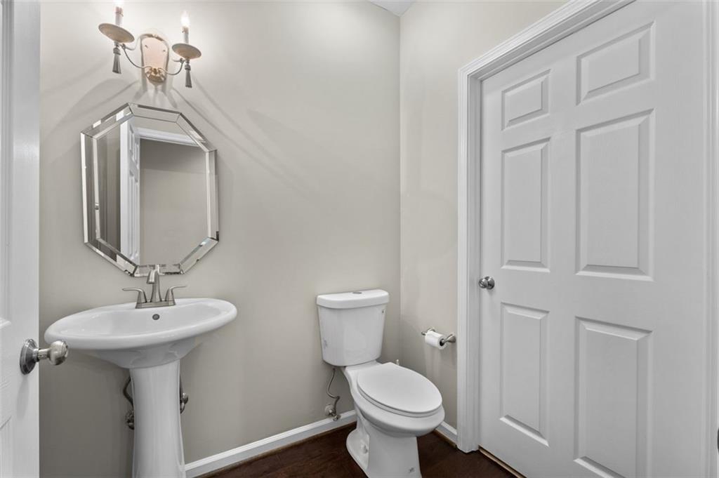 2680 Pine Tree Road Northeast, Unit 5 Atlanta, GA 30324 - Photo 9 of 32 a bathroom with a sink and a toilet