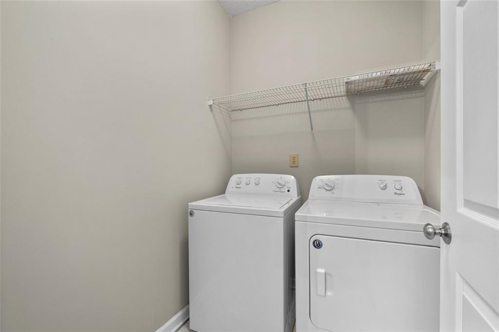 2680 Pine Tree Road Northeast, Unit 5 Atlanta, GA 30324 - Photo 10 of 32 a utility room with dryer and washer