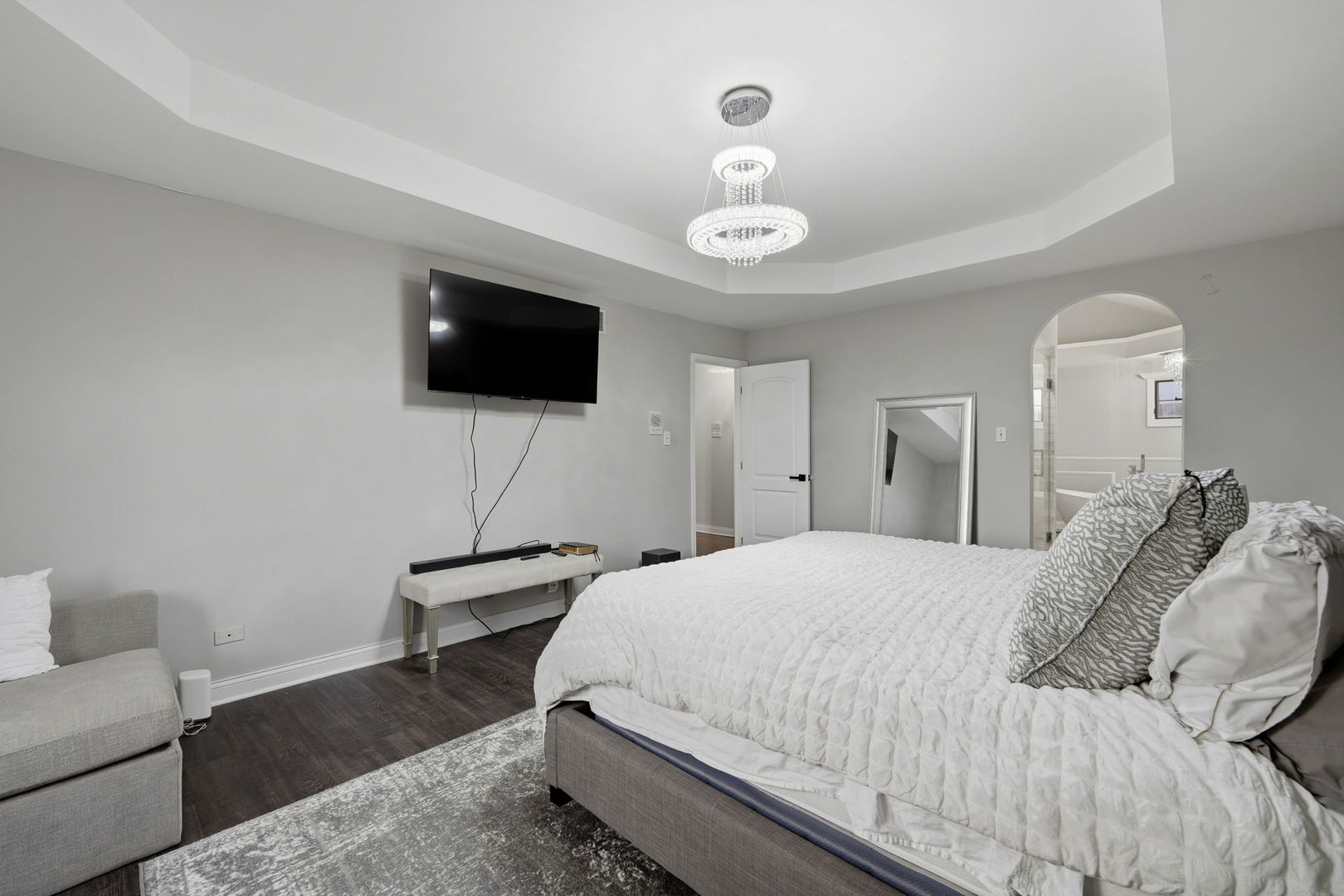 22931 Ridgeway Avenue Richton Park, IL 60471 - Photo 13 of 32 a bedroom with a bed a flat screen tv and a chandelier
