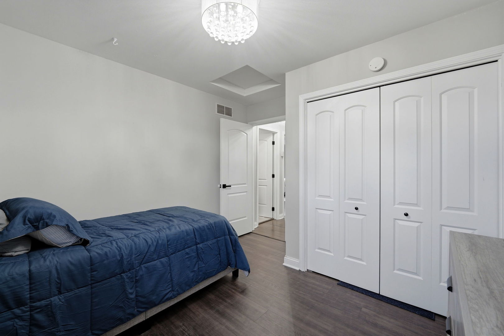 22931 Ridgeway Avenue Richton Park, IL 60471 - Photo 18 of 32 a bedroom with a bed and a chandelier