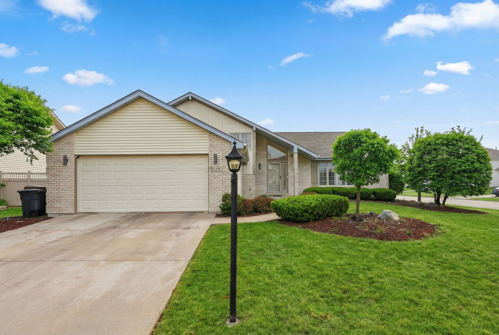 22931 Ridgeway Avenue Richton Park, IL 60471 - Photo 2 of 32 a front view of a house with a garden and plants