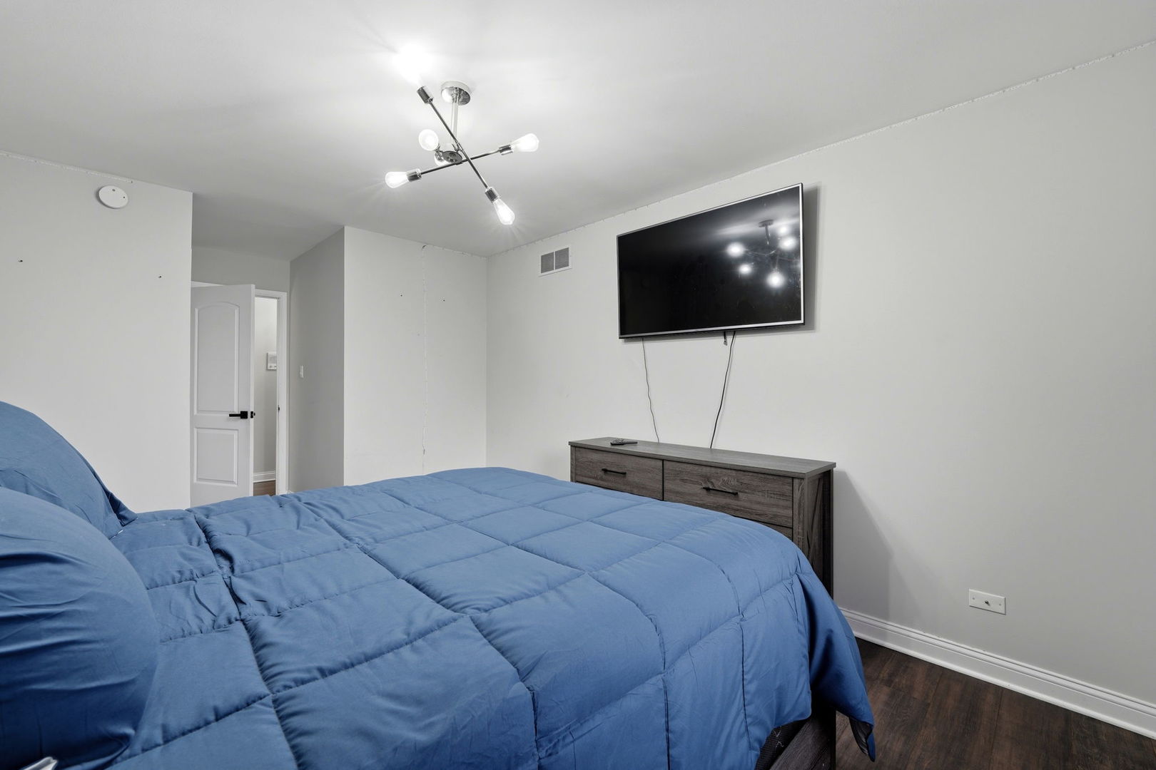 22931 Ridgeway Avenue Richton Park, IL 60471 - Photo 22 of 32 a bedroom with a bed and a flat screen tv