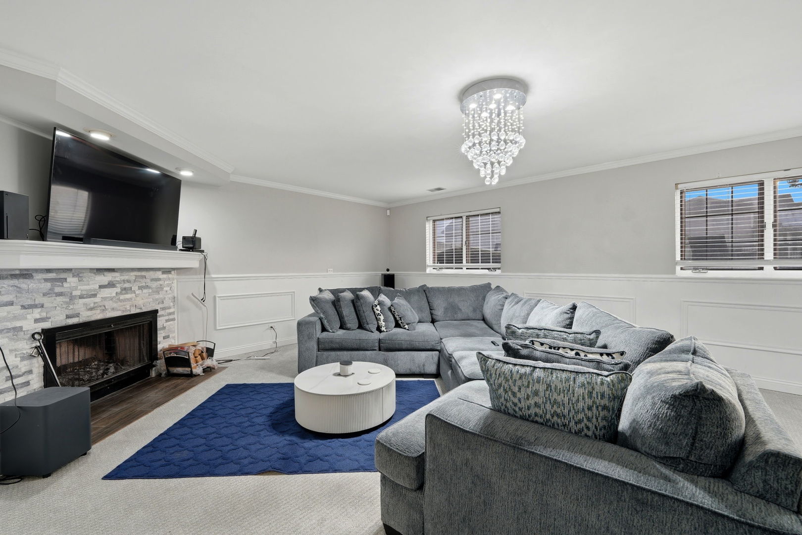 22931 Ridgeway Avenue Richton Park, IL 60471 - Photo 24 of 32 a living room with furniture a fireplace and a flat screen tv