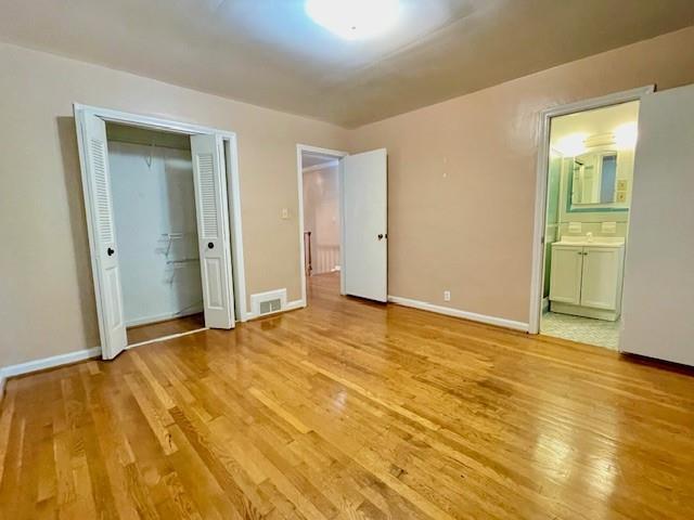 2396 Lavista Road Northeast Atlanta, GA 30329 - Photo 16 of 28 a view of an empty room with wooden floor