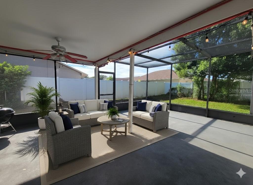 12427 Willow Tree Avenue Hudson, FL 34669 - Photo 2 of 27 a living room with patio furniture and garden view