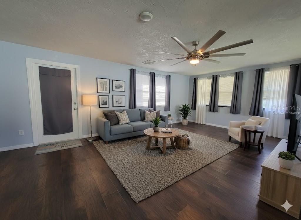 12427 Willow Tree Avenue Hudson, FL 34669 - Photo 3 of 27 a living room with furniture and a large window