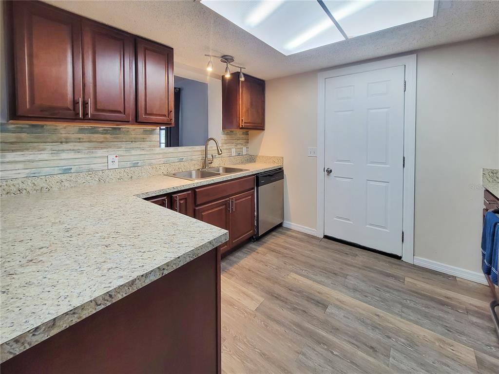 12427 Willow Tree Avenue Hudson, FL 34669 - Photo 10 of 27 an empty room with wooden floor