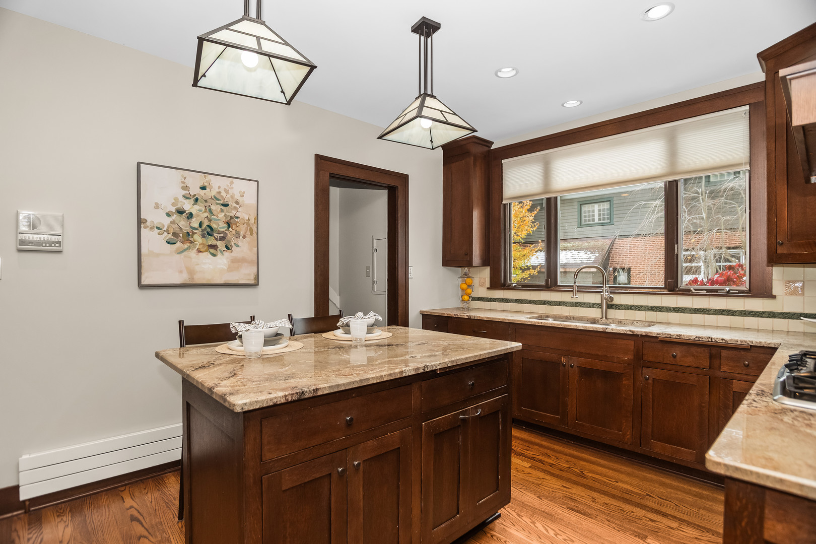2528 Sheridan Road Evanston, IL 60201 - Photo 19 of 55 a dining hall with stainless steel appliances granite countertop a sink and dishwasher with wooden floor