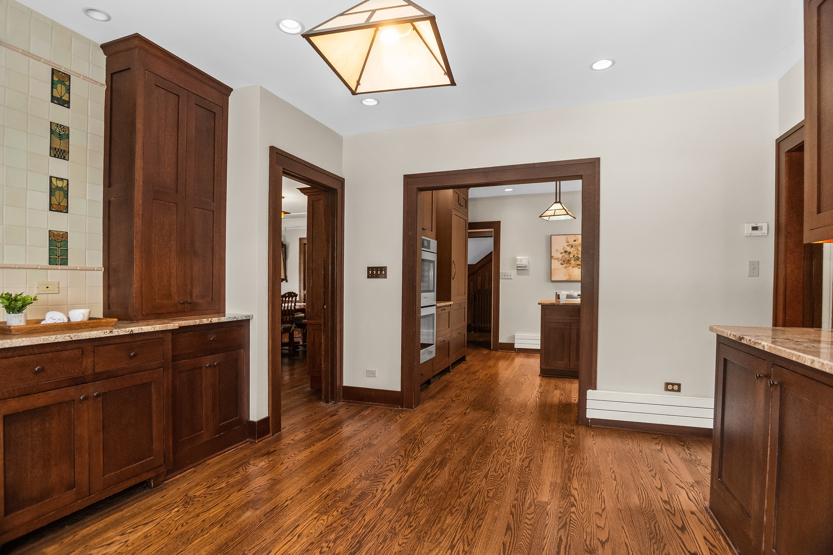 2528 Sheridan Road Evanston, IL 60201 - Photo 23 of 55 a view of a hallway with wooden floor and staircase