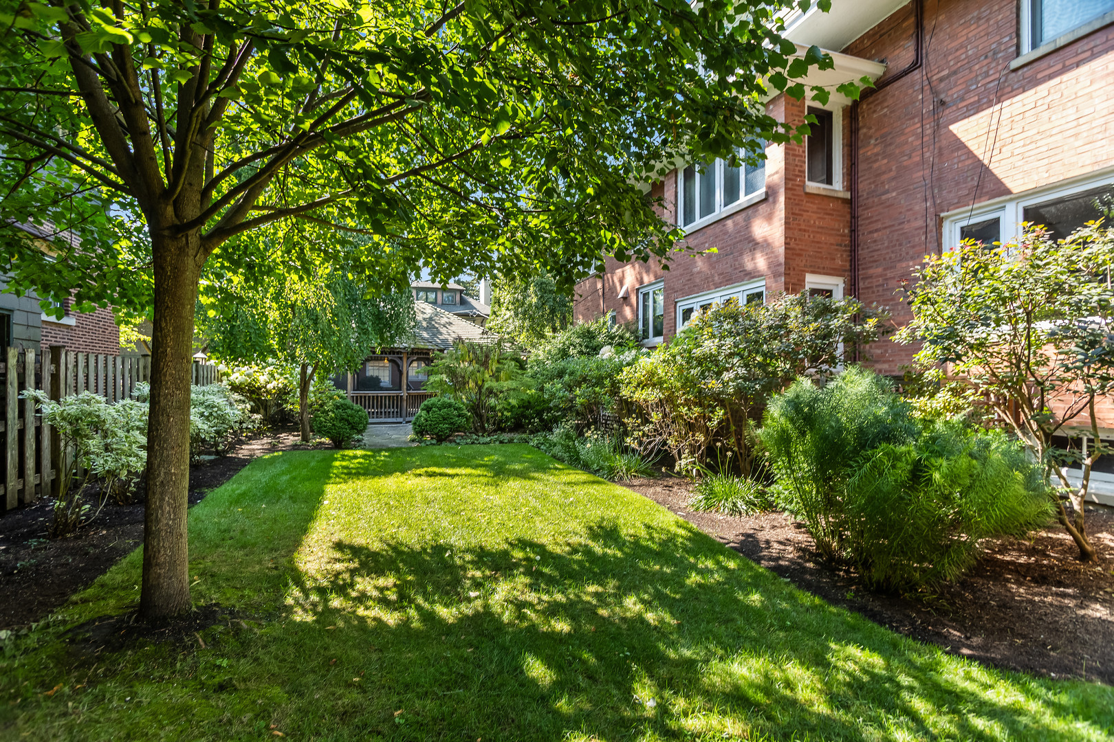 2528 Sheridan Road Evanston, IL 60201 - Photo 3 of 55 a view of a backyard with plants and large trees