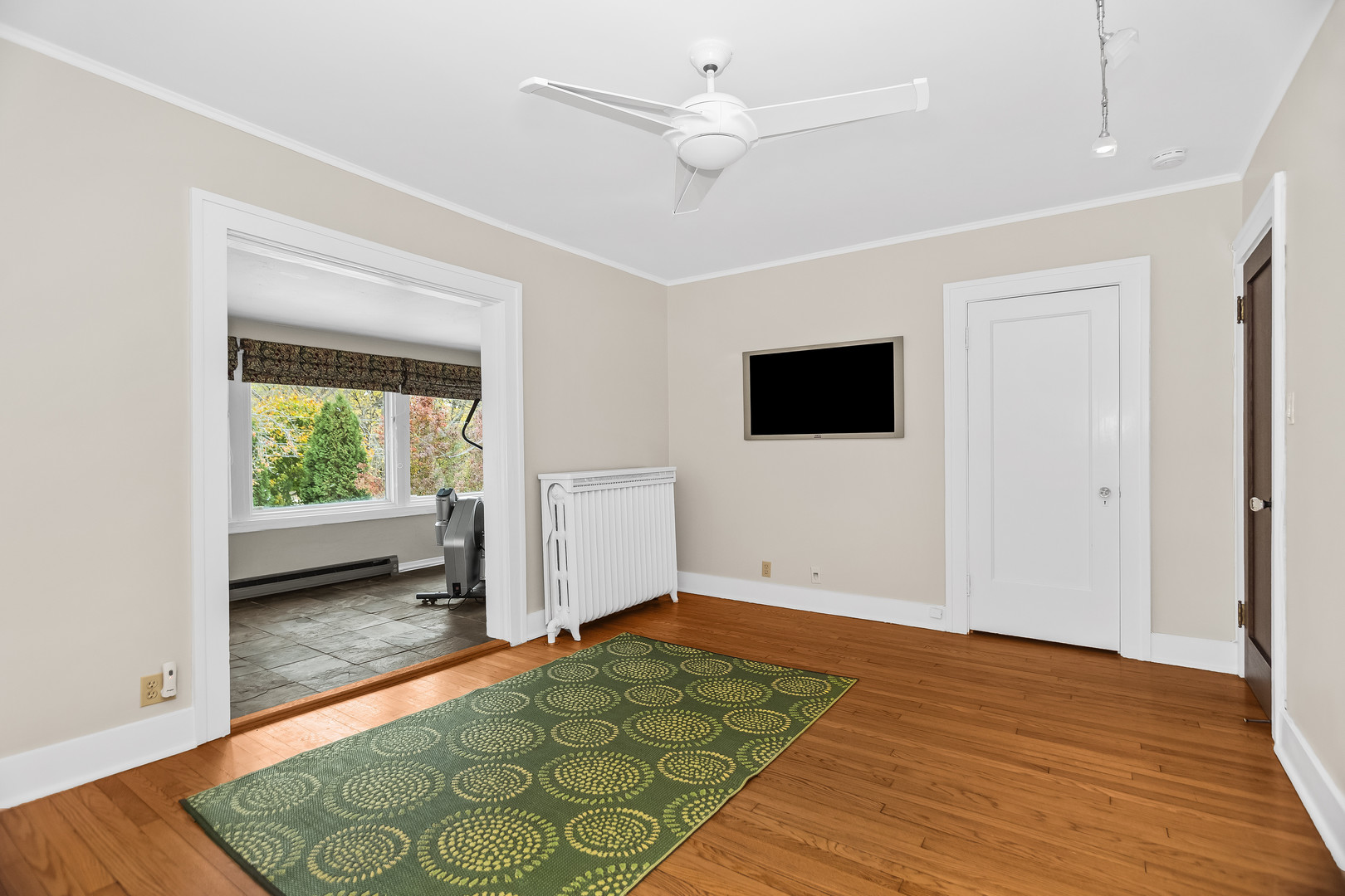2528 Sheridan Road Evanston, IL 60201 - Photo 39 of 55 a view of a livingroom with wooden floor and a ceiling fan