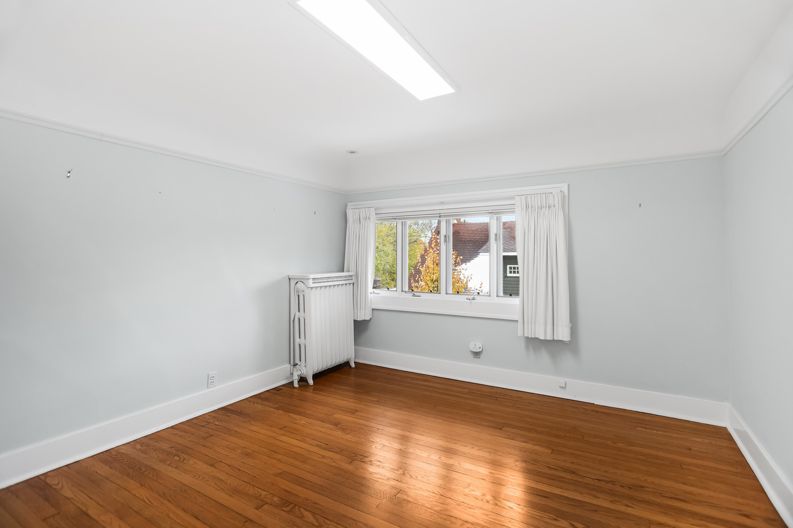 2528 Sheridan Road Evanston, IL 60201 - Photo 49 of 55 an empty room with wooden floor and windows