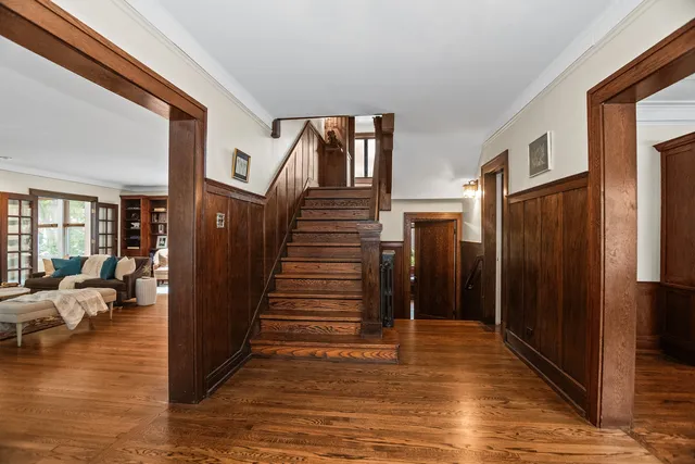 a view of a livingroom with furniture and hardwood floor