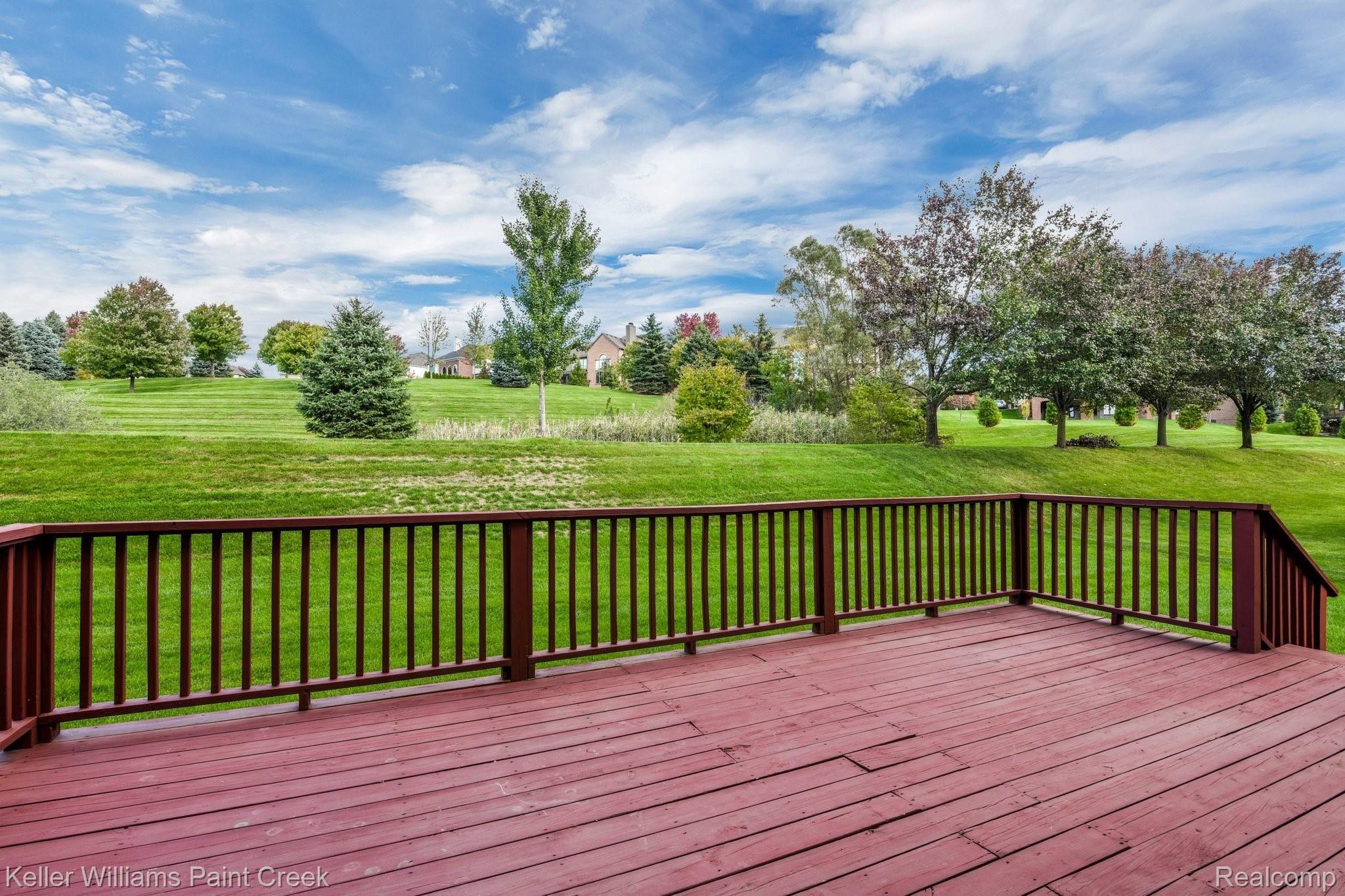 1163 Autumnview Drive Rochester, MI 48307 - Photo 32 of 34 Large deck overlooking the private hilled backdrop.
