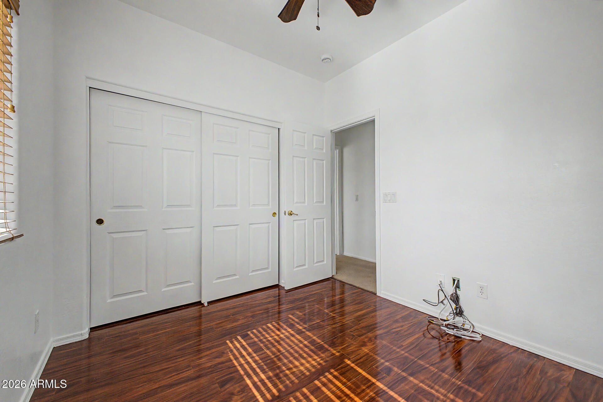 7206 South 12th Way Phoenix, AZ 85042 - Photo 20 of 34 a view of empty room with wooden floor