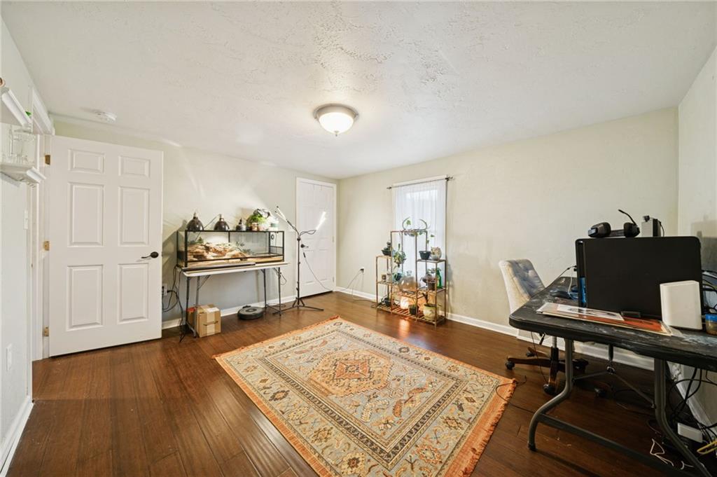 869 Middletown Road New Stanton, PA 15672 - Photo 20 of 30 a living room with dining room and wooden floor