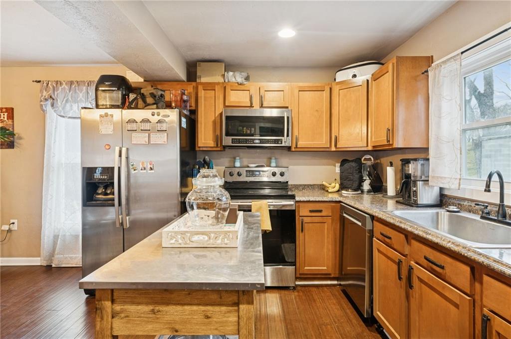 869 Middletown Road New Stanton, PA 15672 - Photo 7 of 30 a kitchen with stainless steel appliances a stove a sink dishwasher a refrigerator and a microwave