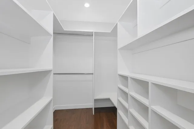 a view of an empty walk in closet