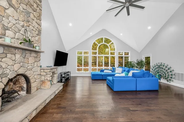 a living room with furniture fireplace and a flat screen tv