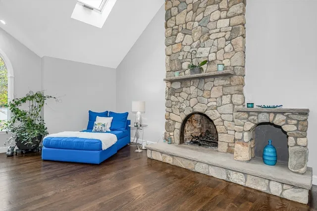 a bedroom with furniture and a flat screen tv