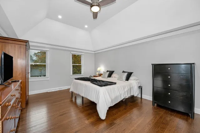 a bed room with bed and a tv