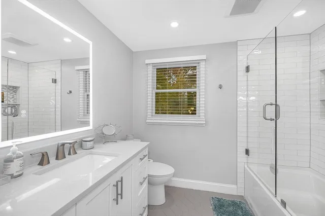 a view of bathroom with washing machine and next to a window