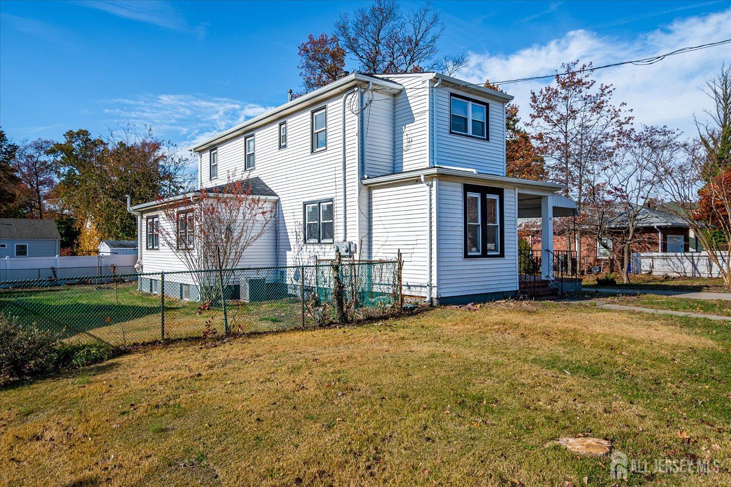 385 Pierson Avenue, Unit 2 Edison, NJ 08837 - Photo 2 of 18 a view of a house with a yard